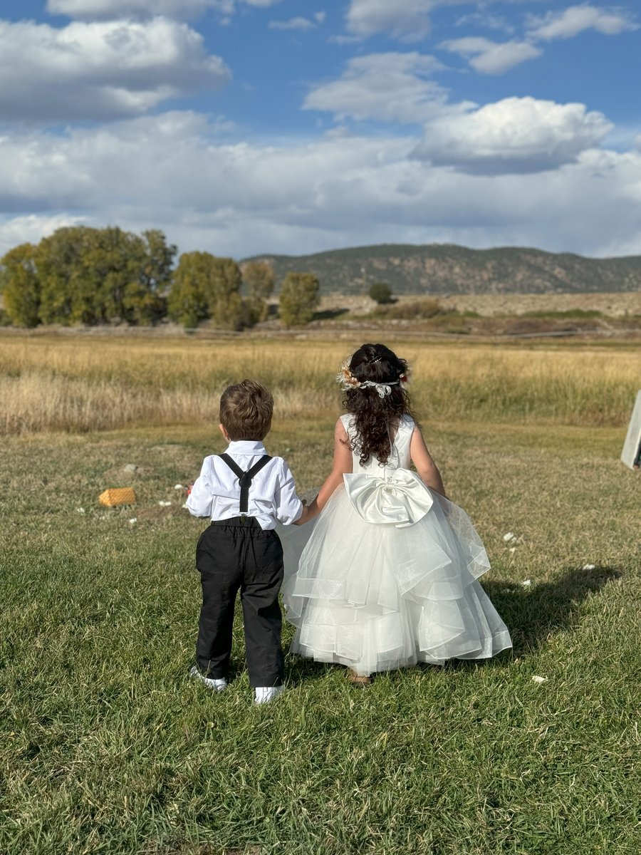 Flower girl and ring bearer walking together